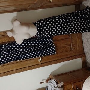 Two long knit polka dot skirts with fold over waist. one Navy and one black.